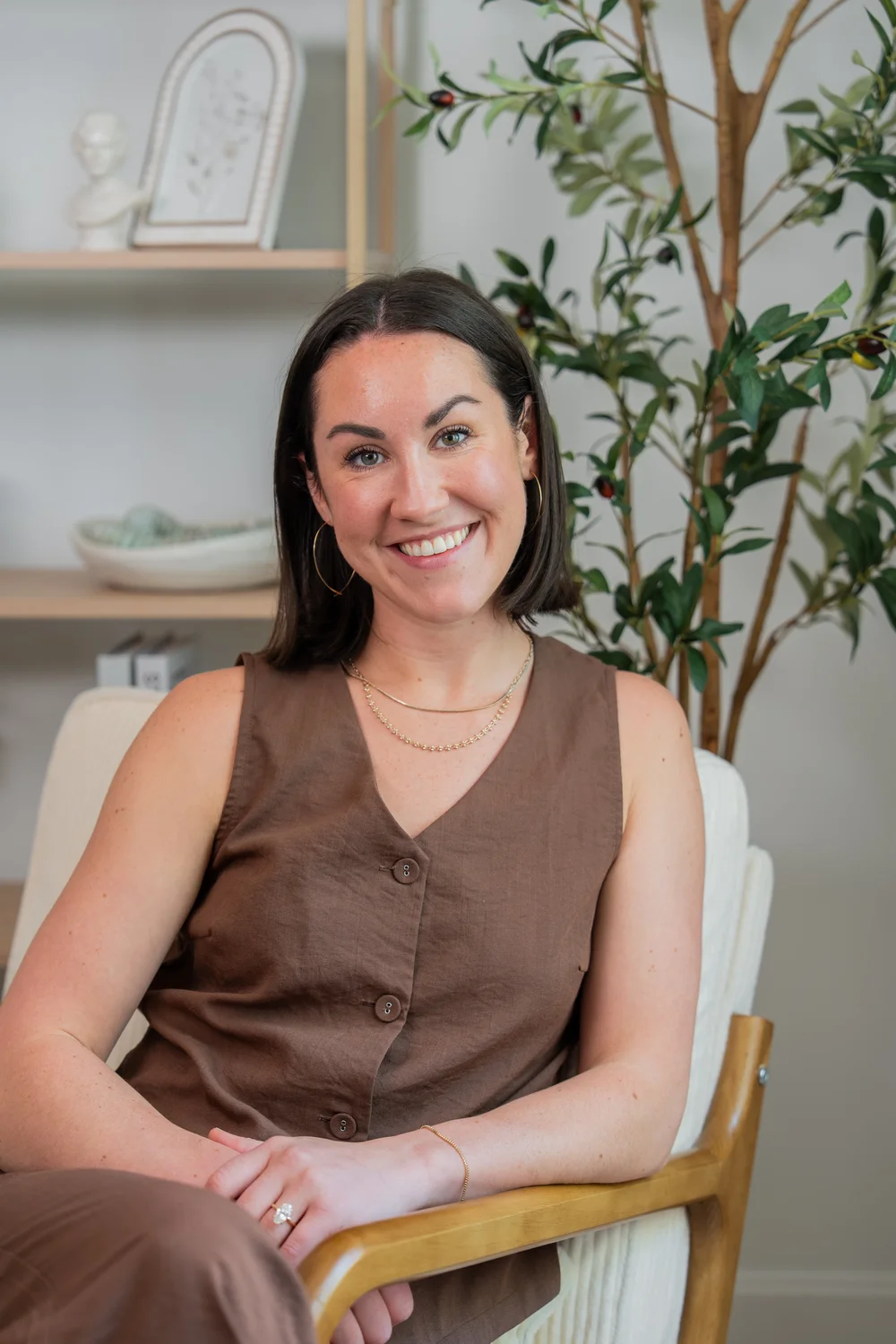 Kate Masterson, chiropractor and functional medicine practitioner, seated in her practice.